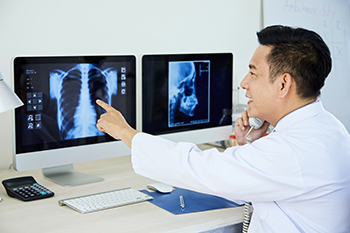 doctor examining an x-ray
